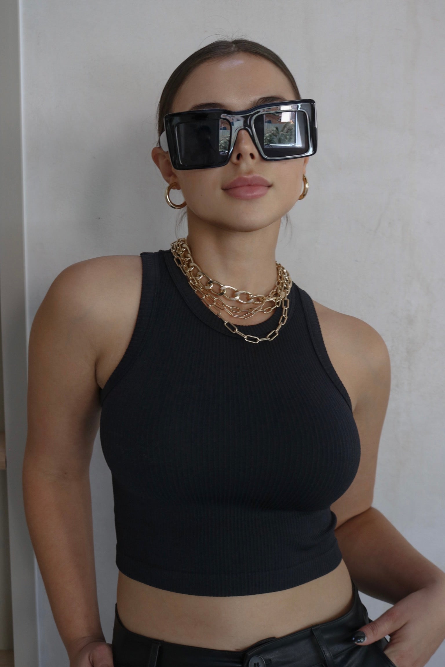 Ribbed Muscle Tank Top in Black. Scarlette The Label, an online fashion boutique for women.