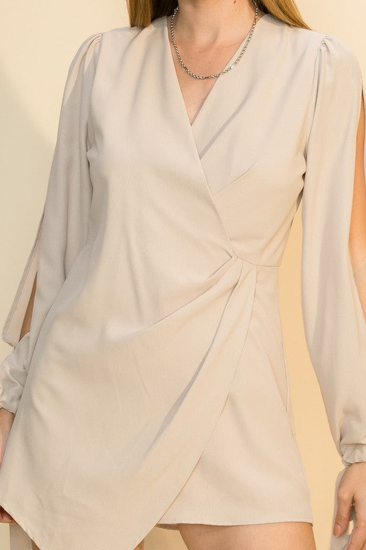 Short Asymmetrical Skort Romper in Sand with slit sleeves from Scarlette The Label, an online fashion boutique for women.